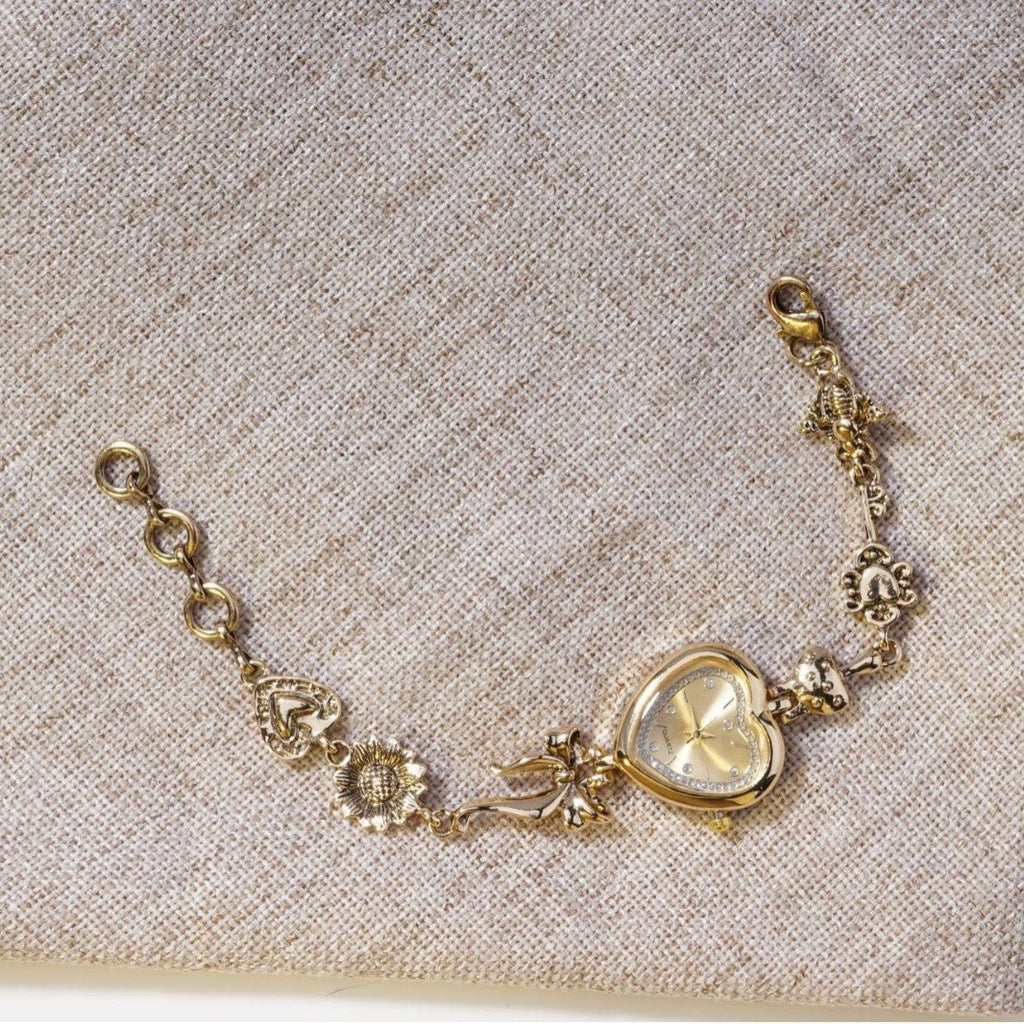 Retro Heart - shaped Bracelet Watch With A Golden Bow And Flower Design A Stylish Womens Timepiece - Oopsdadforgot.com