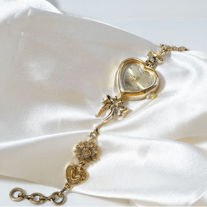 Retro Heart - shaped Bracelet Watch With A Golden Bow And Flower Design A Stylish Womens Timepiece - Oopsdadforgot.com